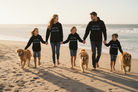 Family of five walking on a beach with three dogs, all wearing matching sweatshirts.